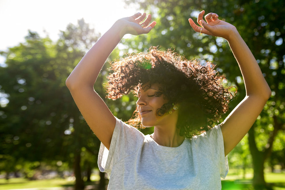 woman in recovery outside feeling relief