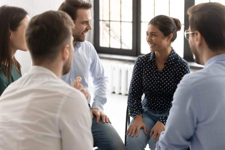 people smiling at each other in therapy