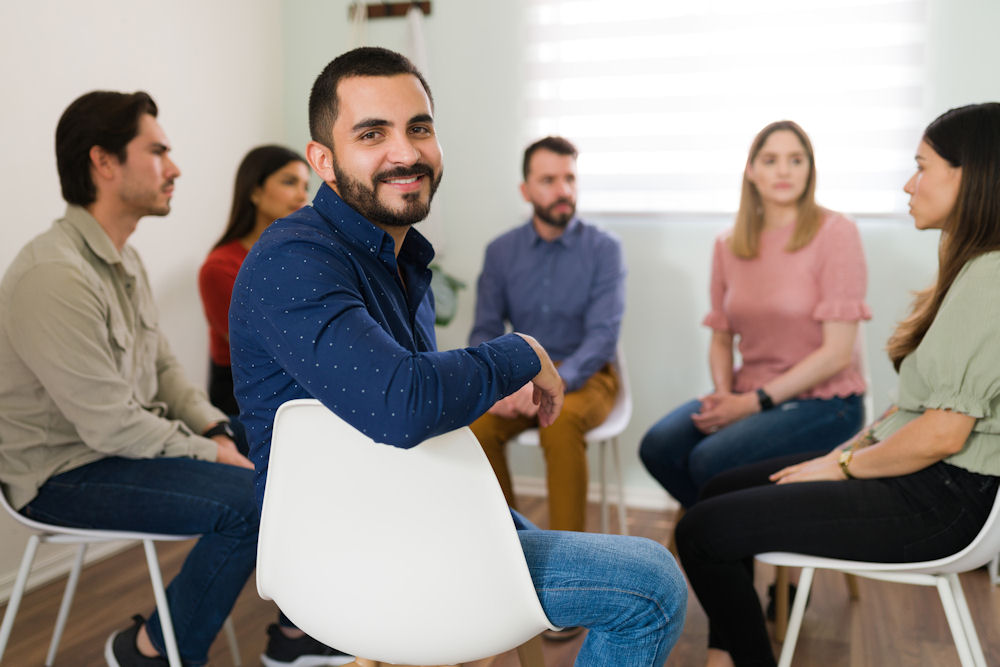 man in group therapy session