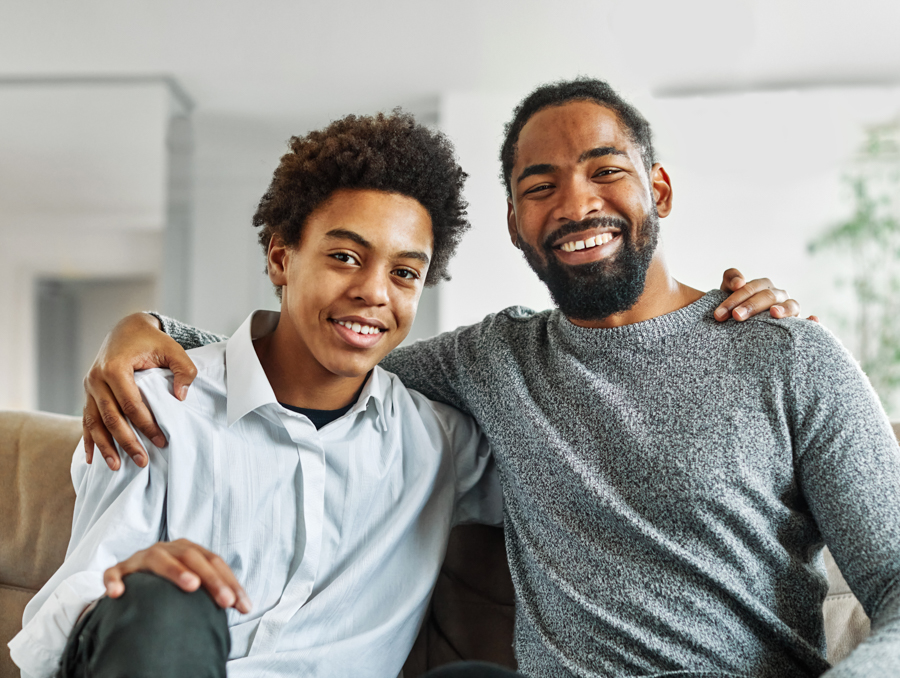 father and son smiling