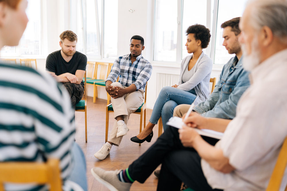 man in group therapy